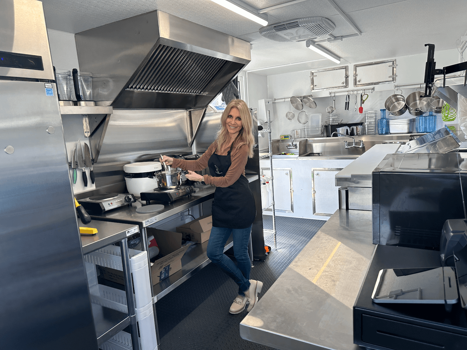 Lisa inside the P53 Nutrition trailer kitchen